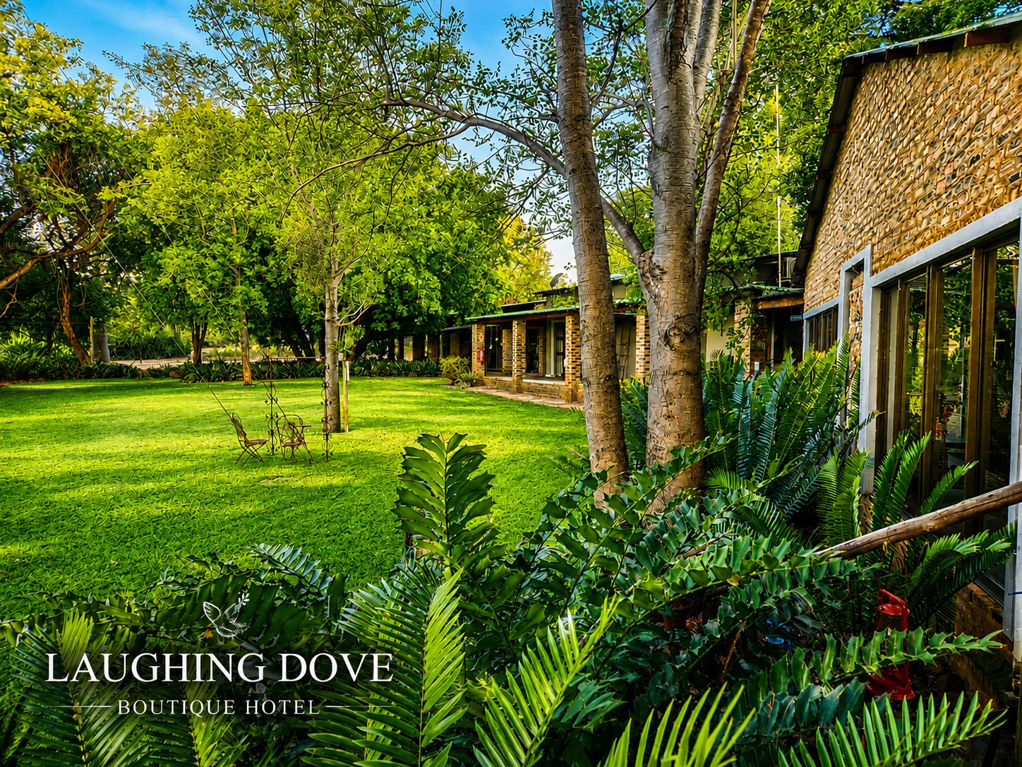 Laughing Dove hotel buildings beside the garden